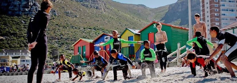 Volunteer Teach Surfing Lessons in South Africa with Projects Abroad Volunteers on the beach on the surfing project in South Africa with Projects Aboard